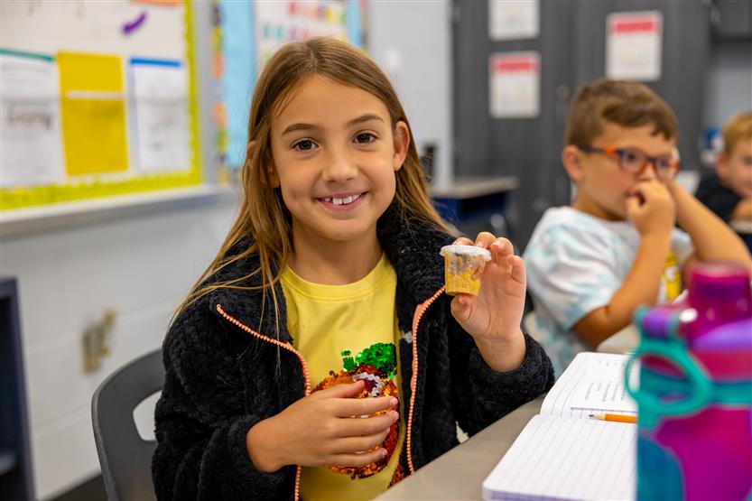 Students smile in science class